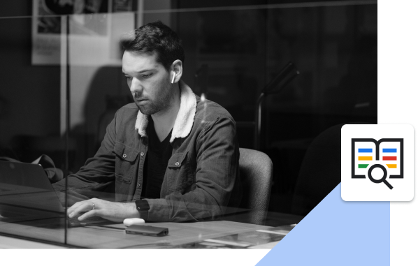 person sitting at desk with laptop